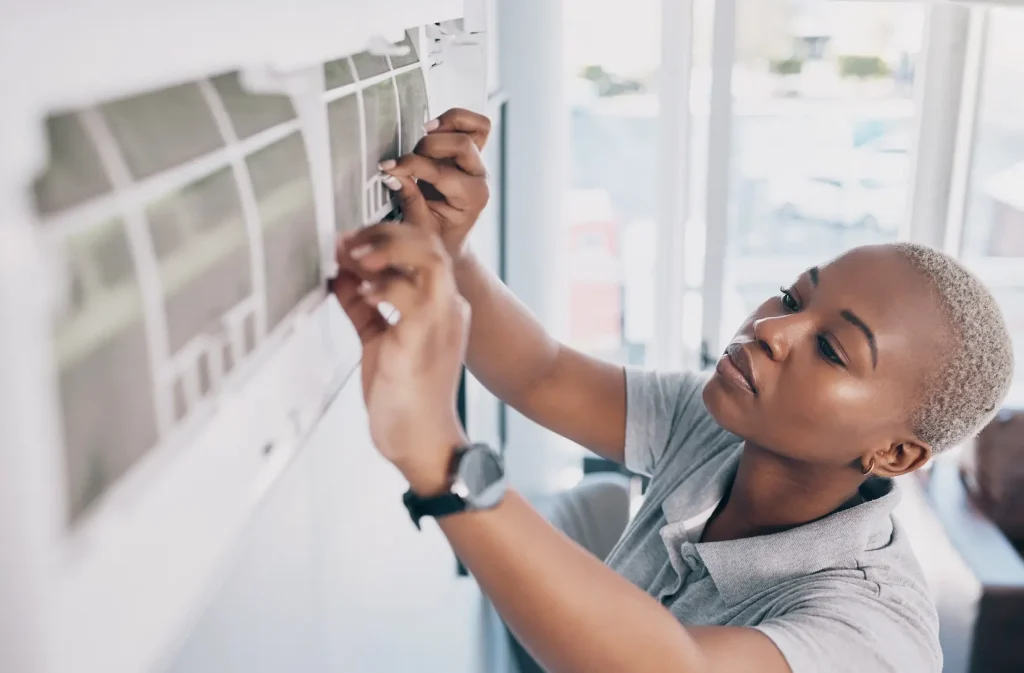 woman installing mini split ac